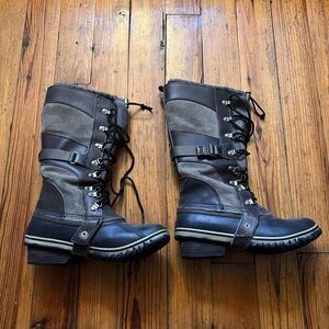 Sorel Woman’s Conquest Carly Black and Brown Tall Lace-Up Boots